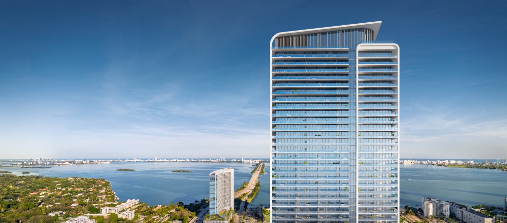 Exterior view of the upcoming condominium tower in Miami's Design District, associated with chef Jean-Georges, next to a body of water.